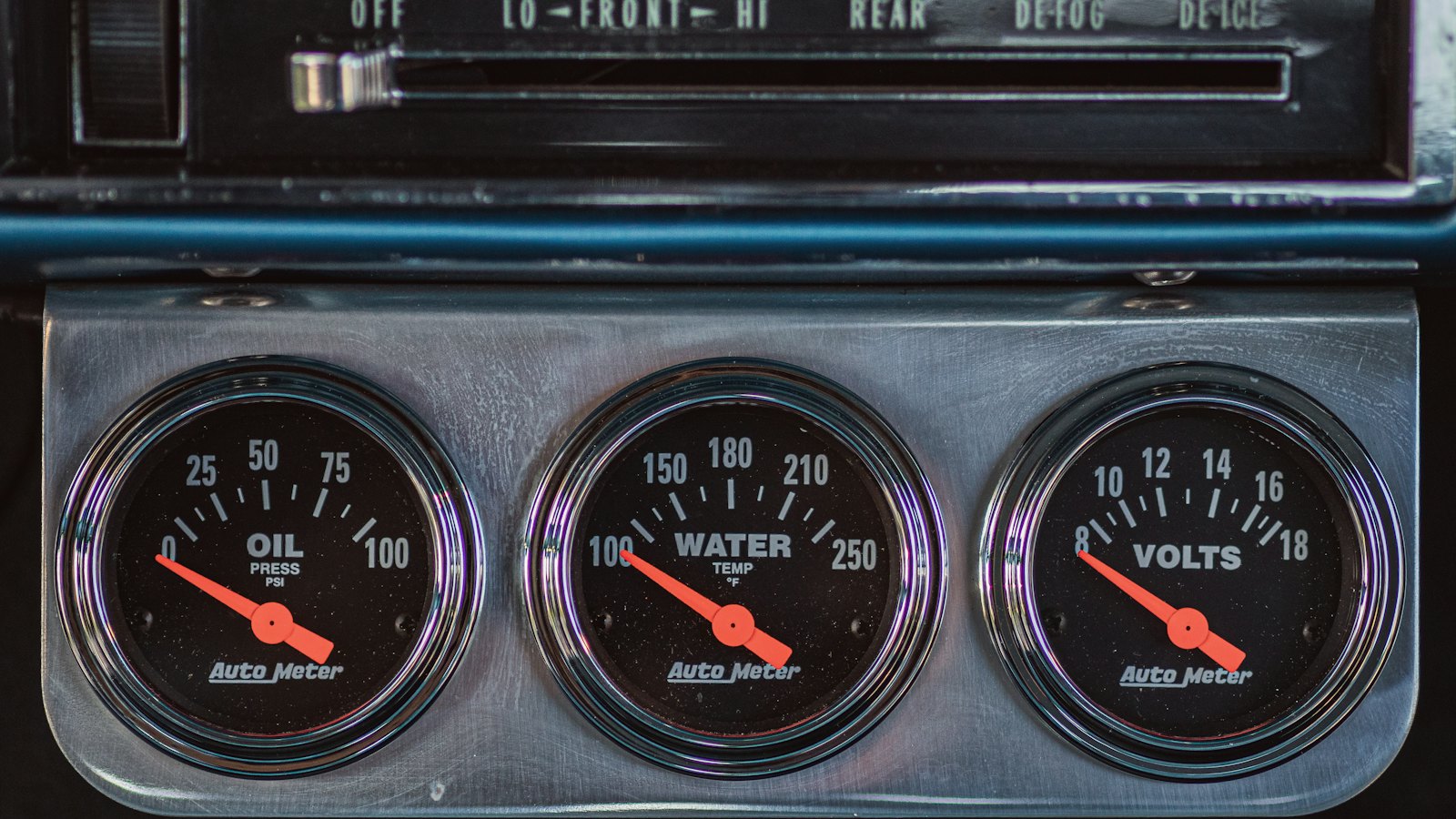 Oil pressure, water temperature and voltage gauges on a car dashboard; the water temperature gauge is where car overheating shows up first