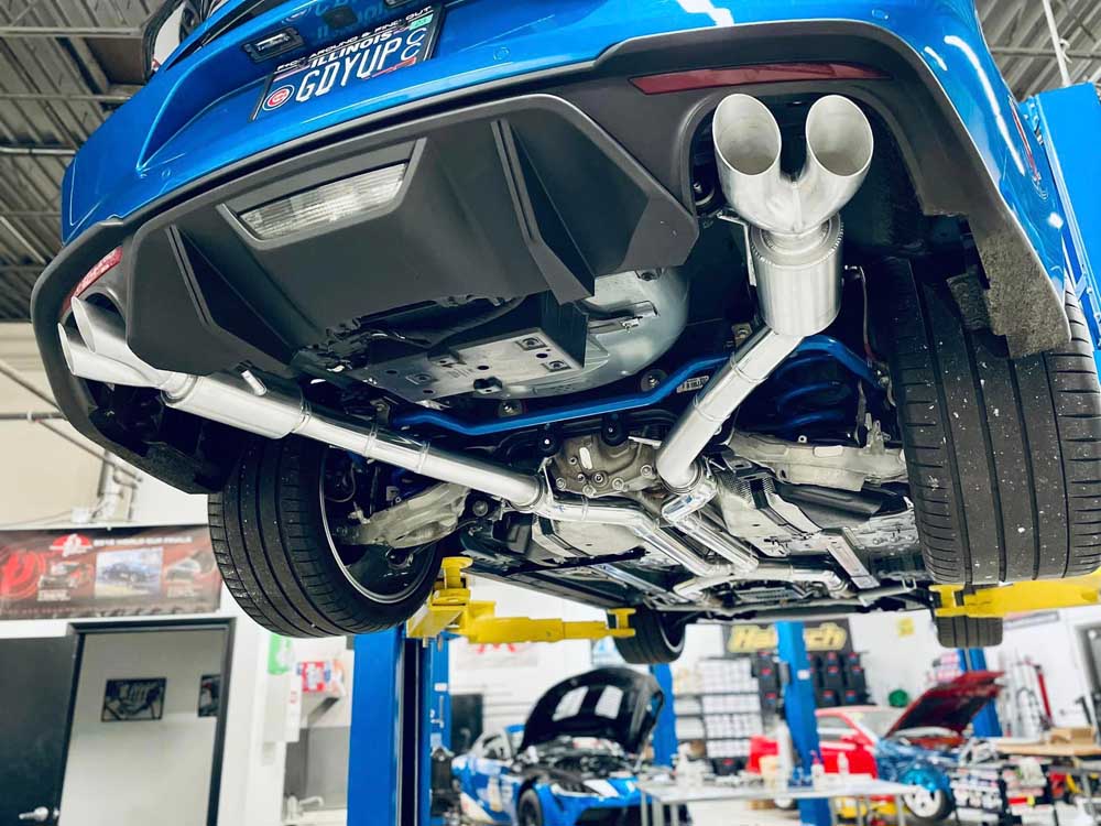 Polished chrome dual exhaust tips on a custom Vorenza performance build