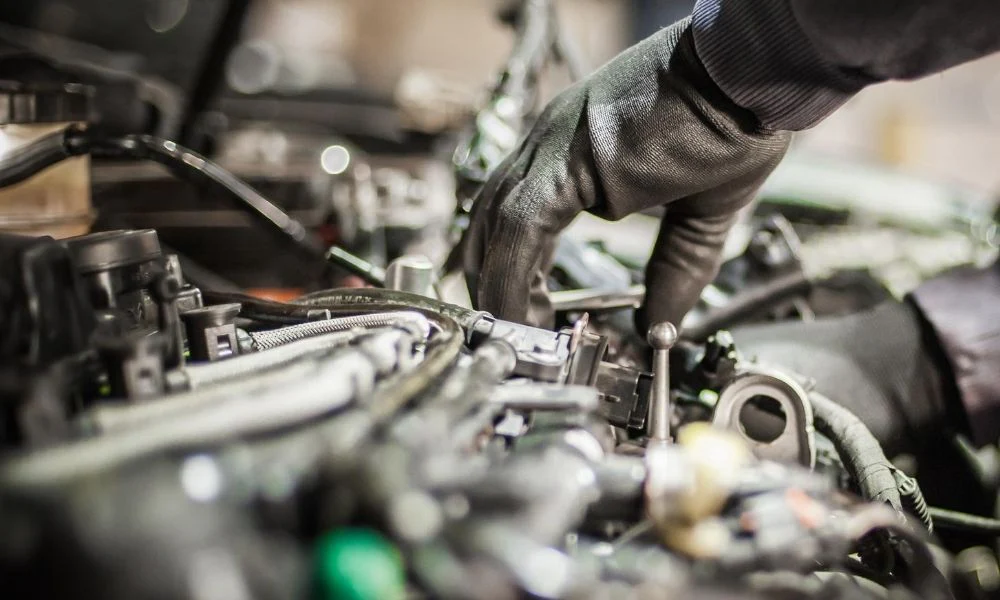 Technician performing hands-on vehicle inspection