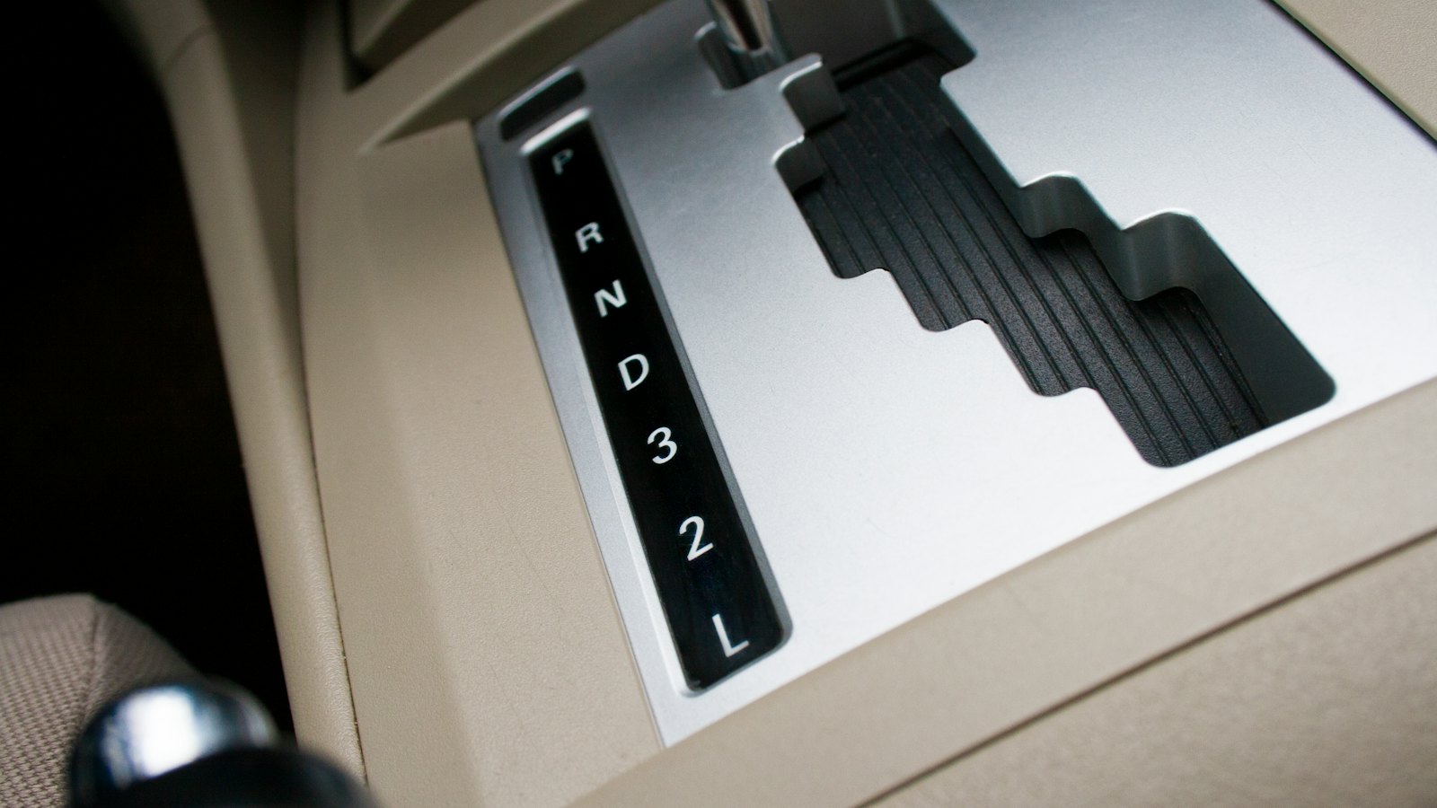 Automatic transmission gear selector showing P, R, N, D, 3, 2 and L, the first place drivers notice transmission slipping